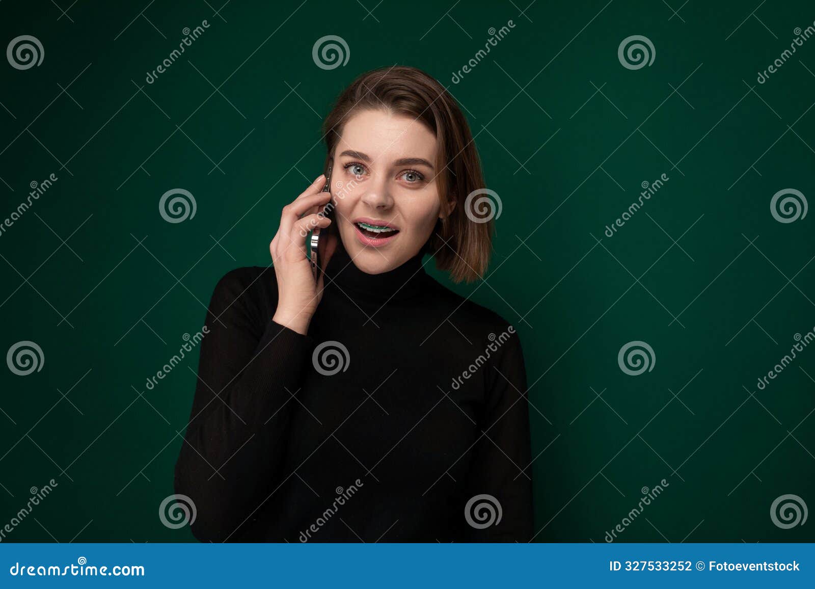 woman talking on cell phone with surprised expression