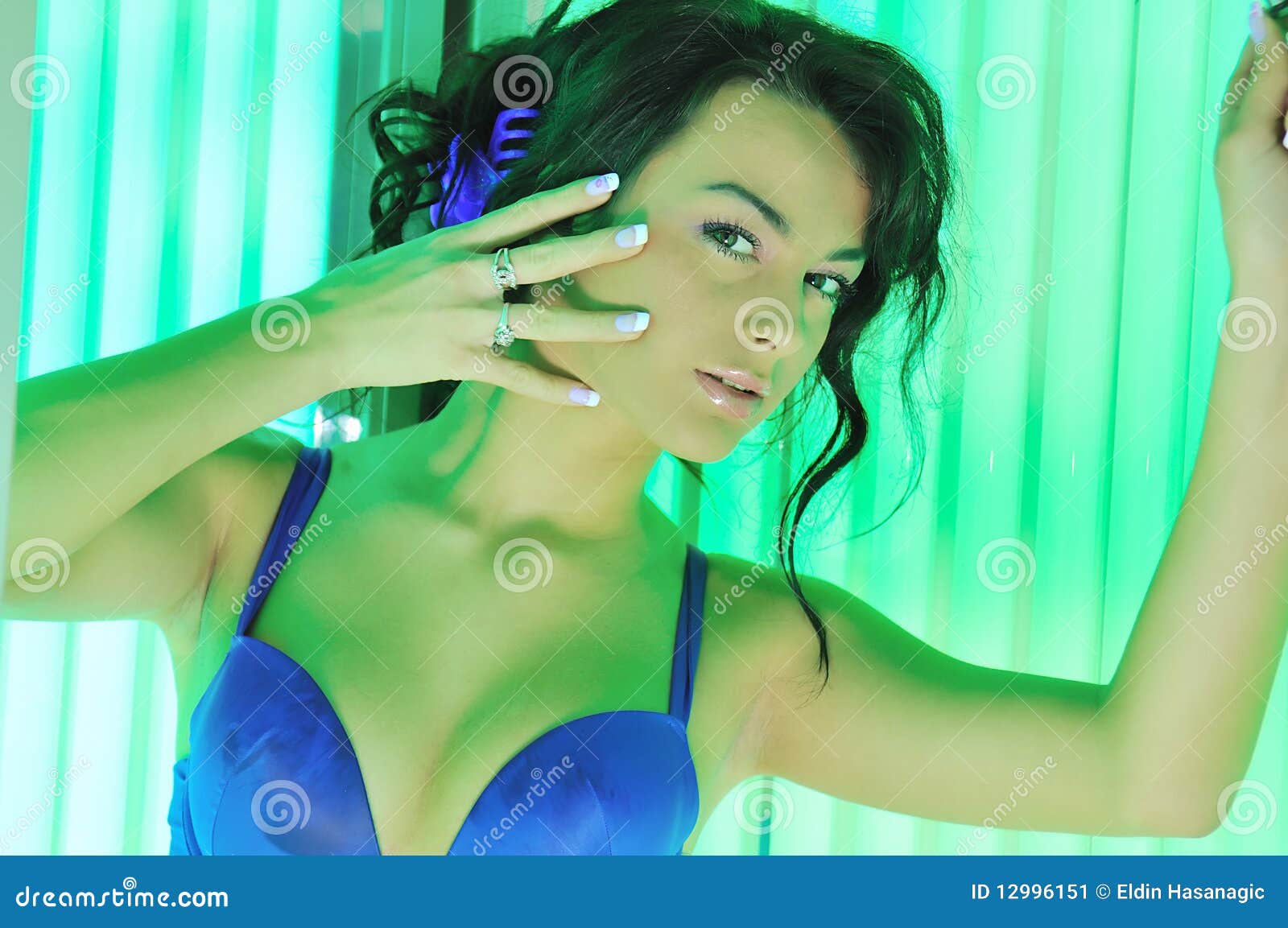 Woman in tanning booth stock image. Image of hands, cacuasian 12996151