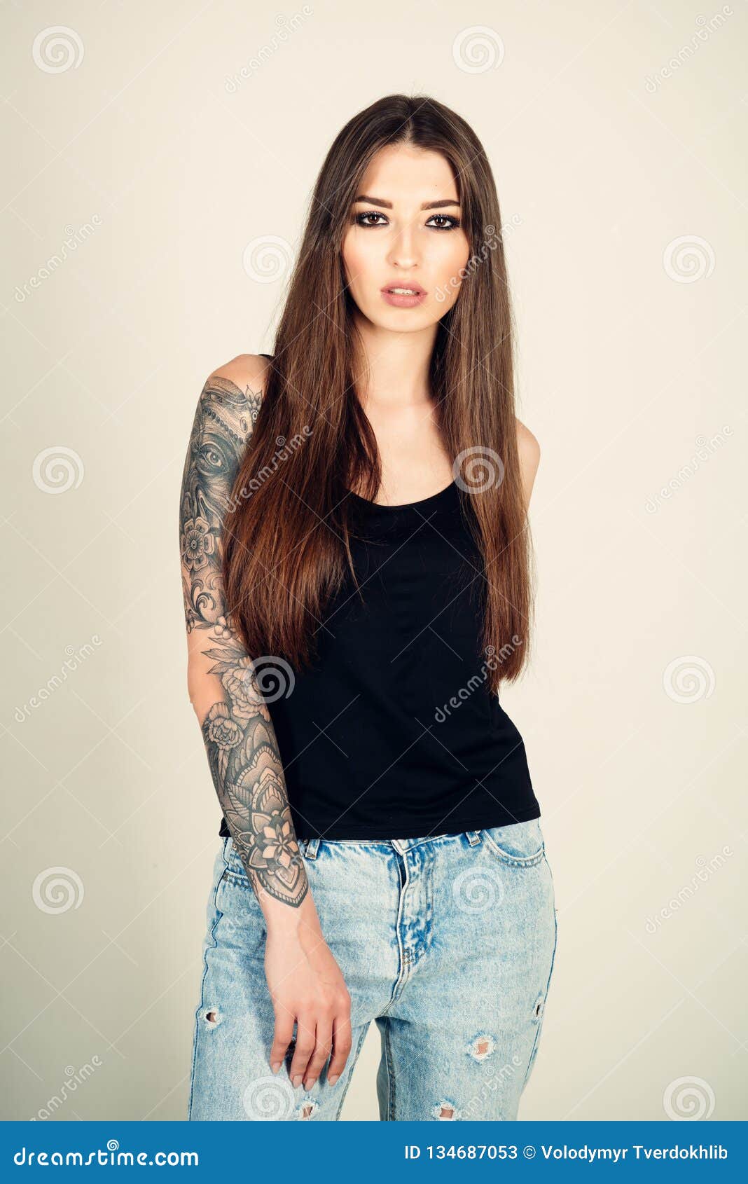 Woman with Tattoo Arm in Jeans, Fashion. Stock Image - Image of makeup, caucasian: 134687053 Woman with Tattoo Arm in Jeans, Fashion. Stock Image - Image of makeup, caucasian: 134687053