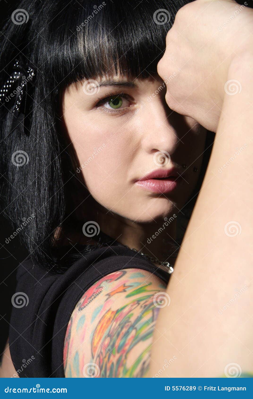 Woman with tattoo and fist stock image. Image of contentment - 5576289