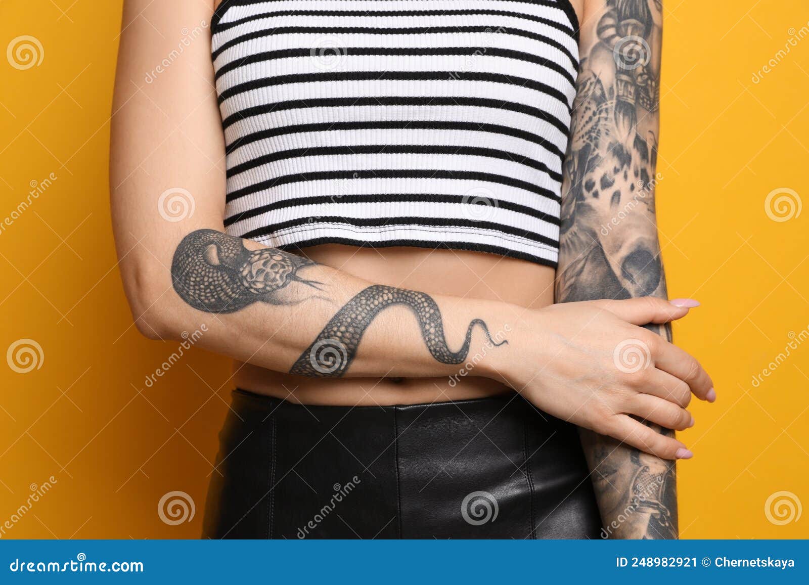 Man With Tattoos Standing Against White Background High-Res Stock Photo -  Getty Images