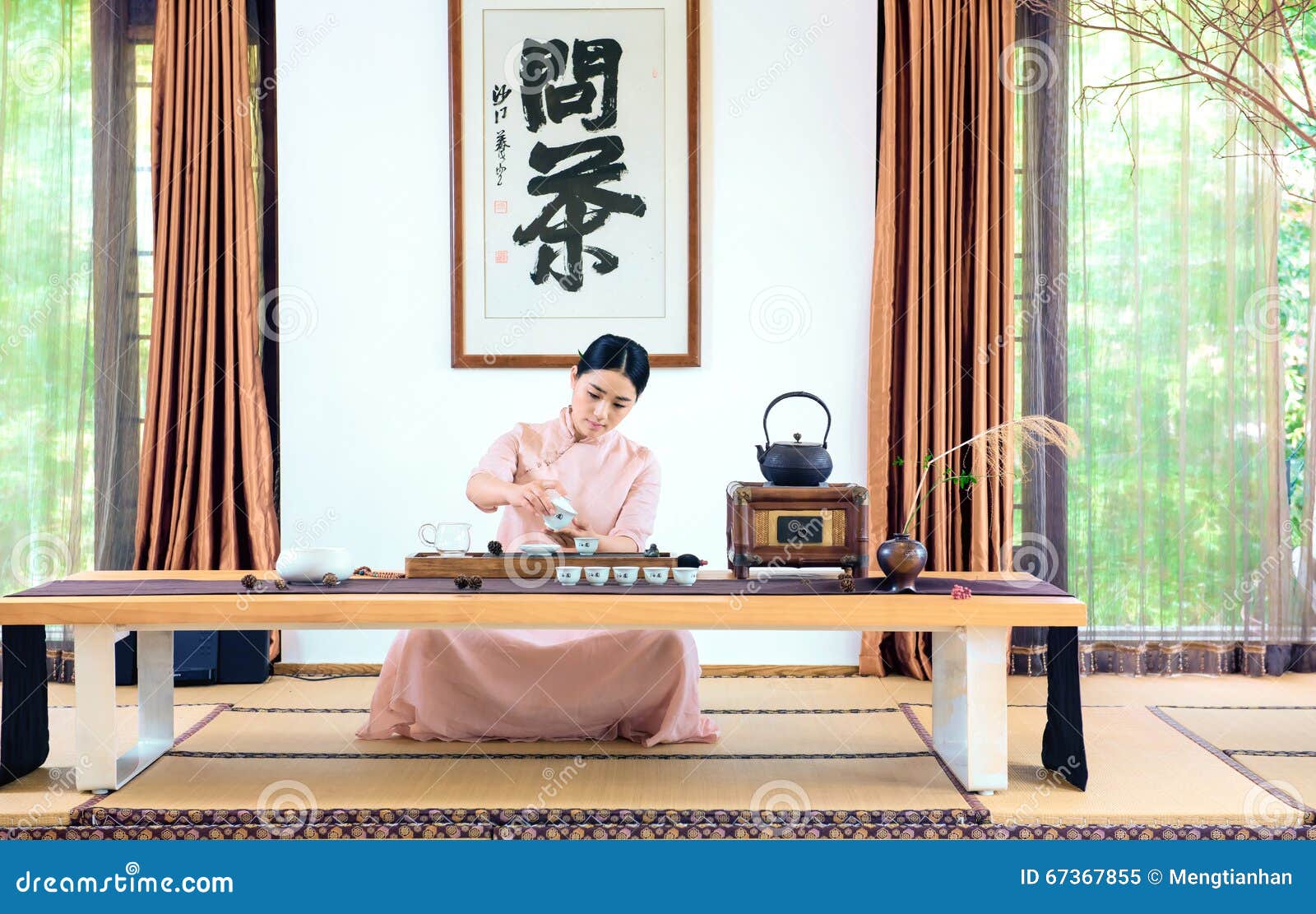 a woman with a teapot-china tea ceremony