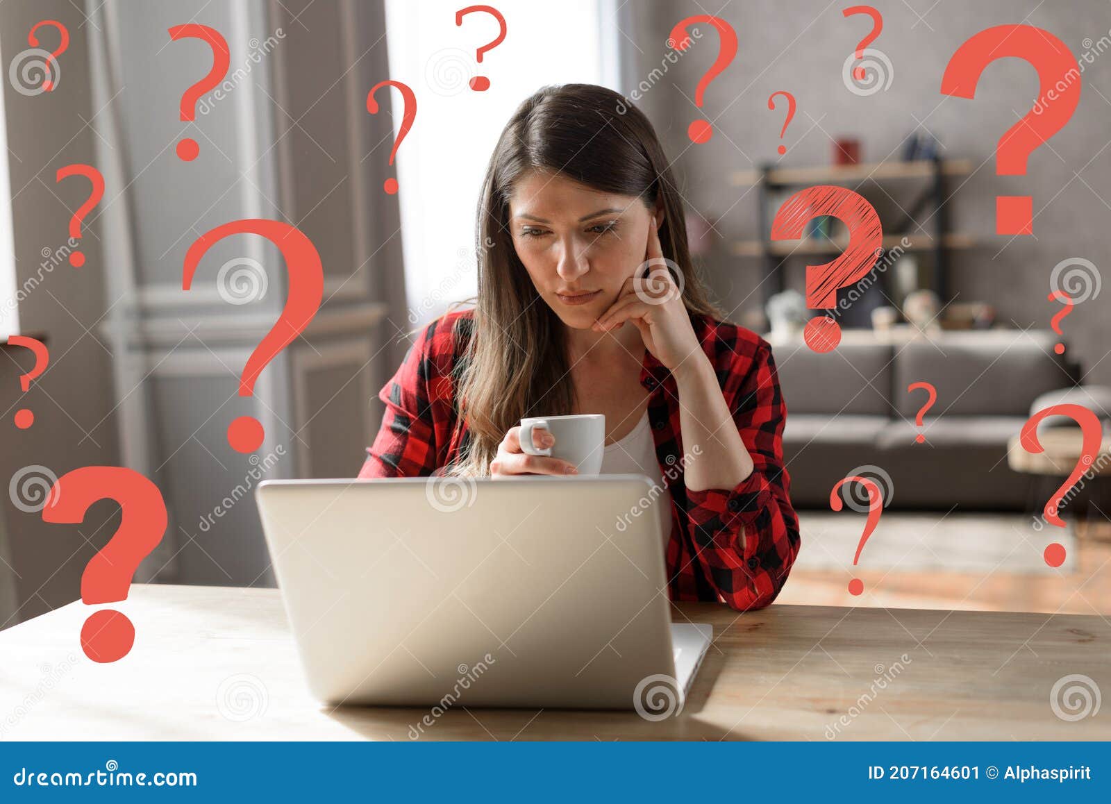 woman teleworker works at home with a laptop but has some questions