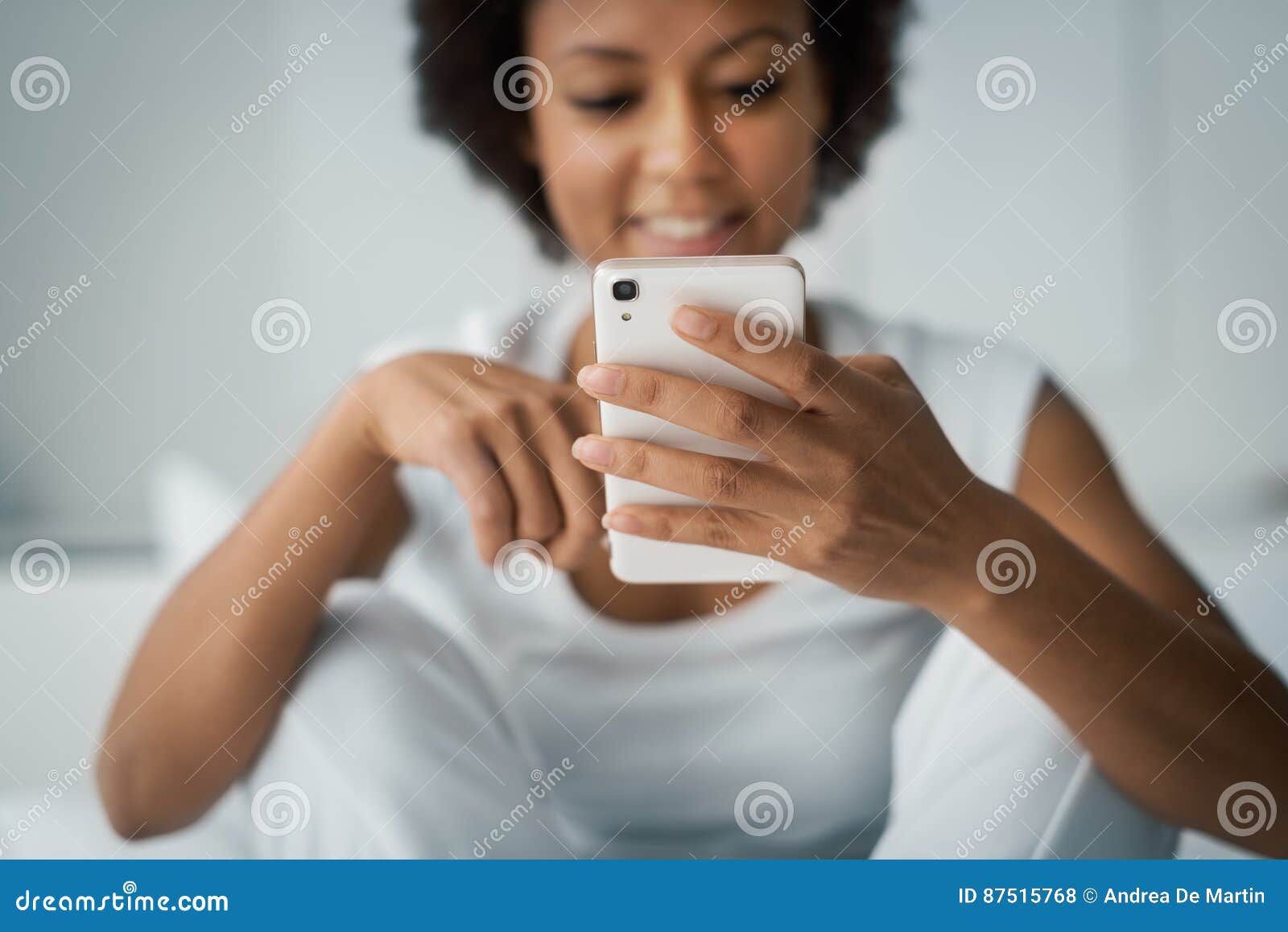 woman texting with her smartphone