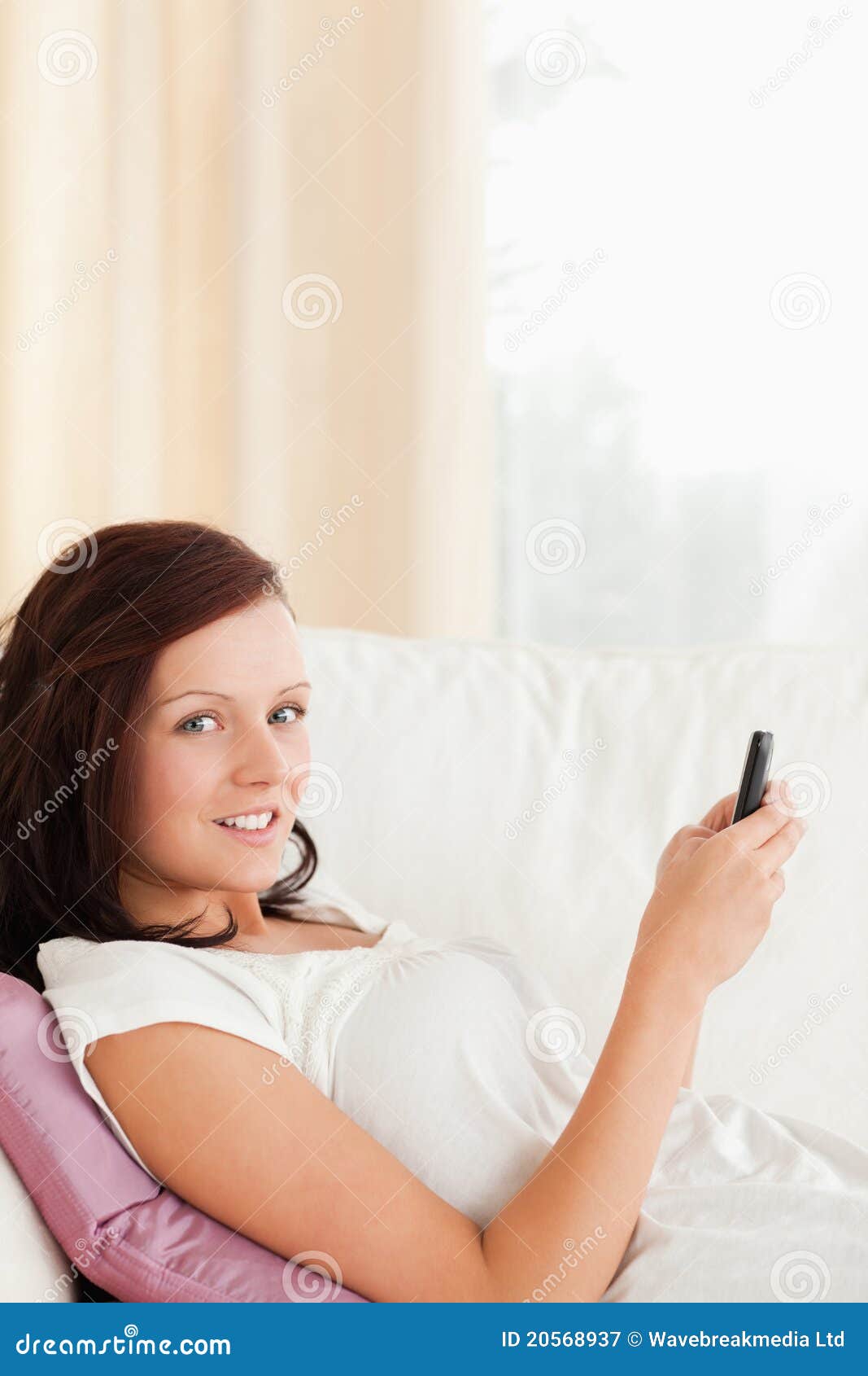 Woman Texting on Mobile Looking into Camera Stock Image - Image of ...