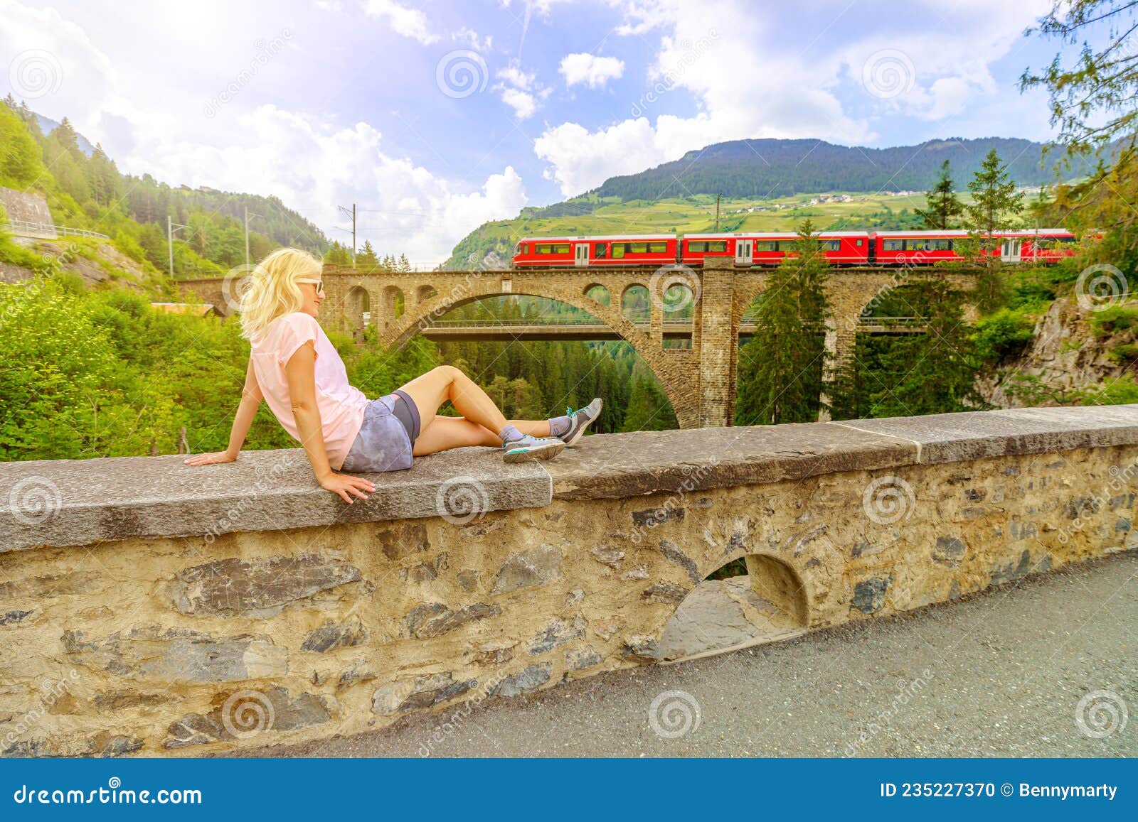 woman on solis viaduct of swiss railway