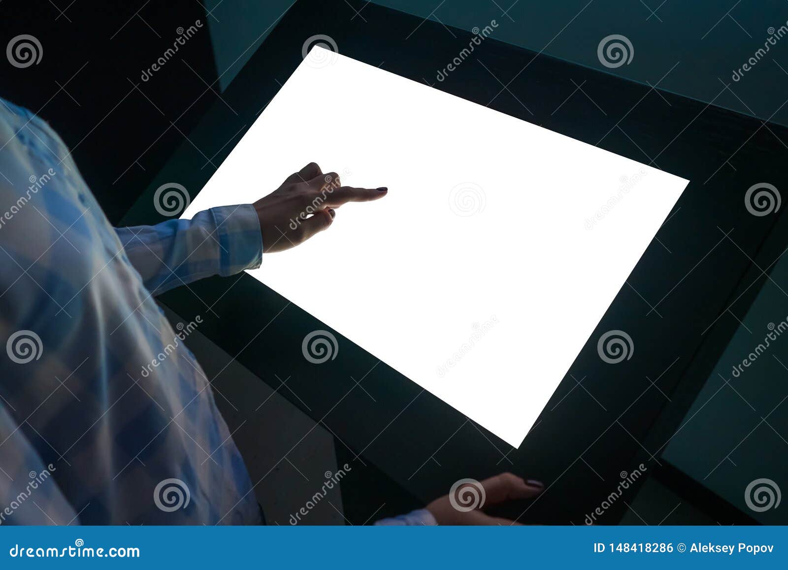 woman touching interactive white blank touchscreen display kiosk at exhibition