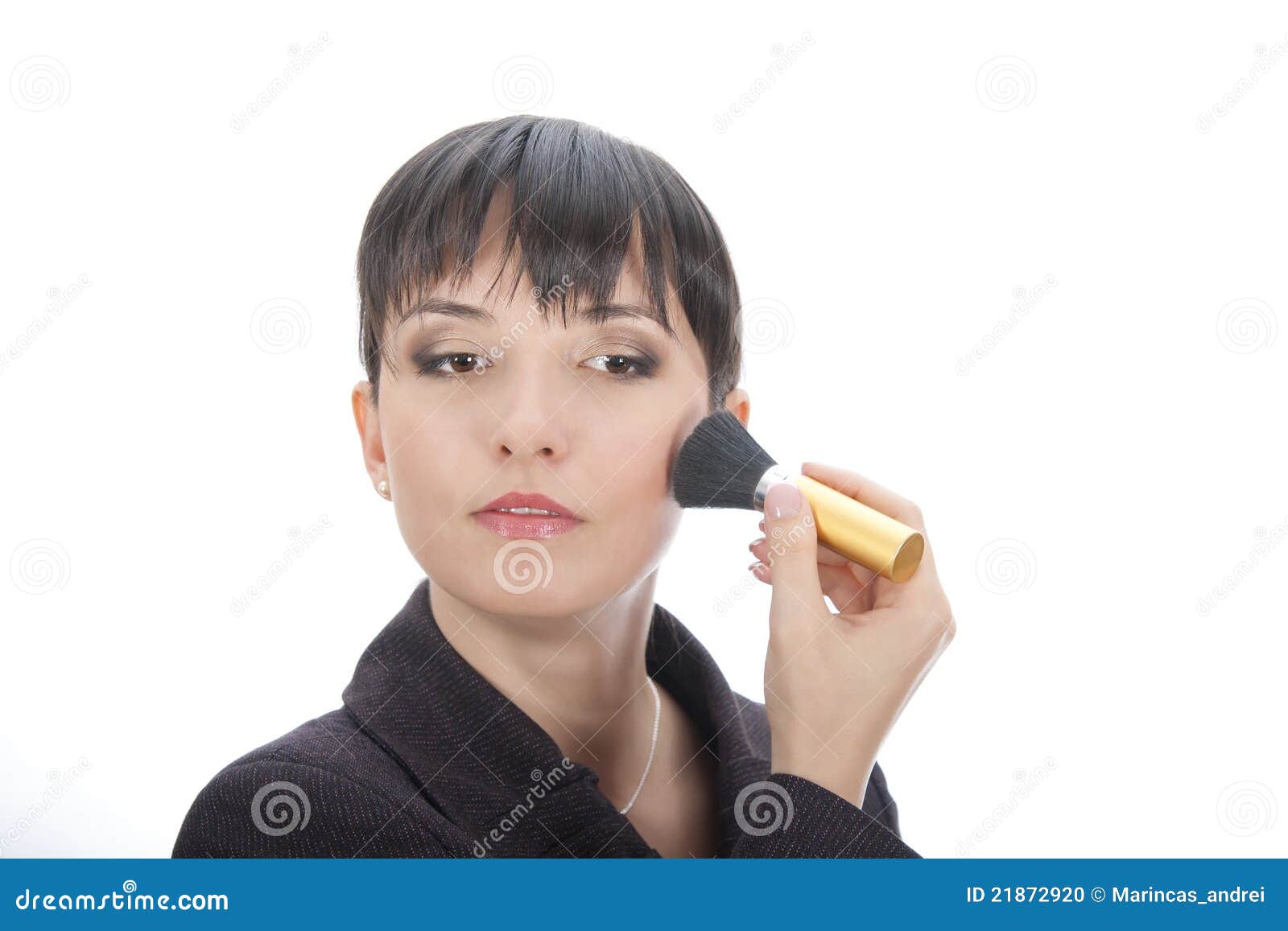 Woman touching up her make stock photo. Image of girl 21872920