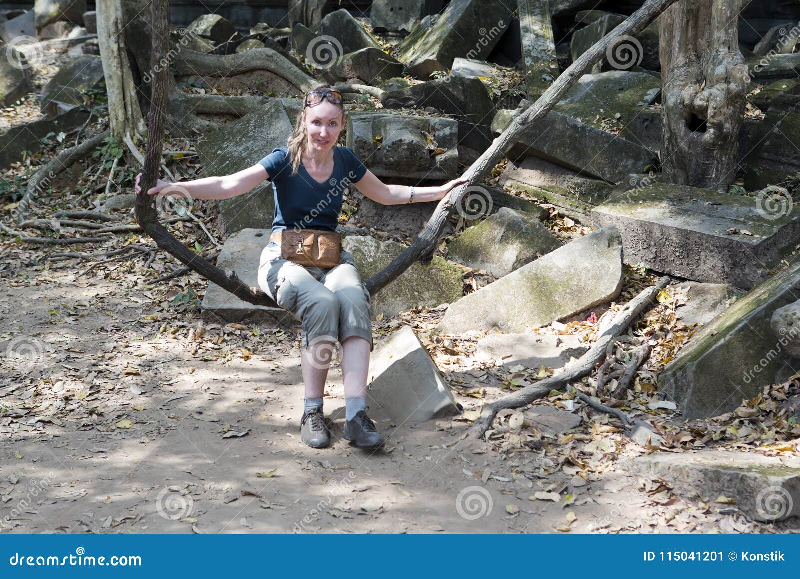 Woman, the Tourist, Shakes on a Liana As on a Swing on Beng Mealea