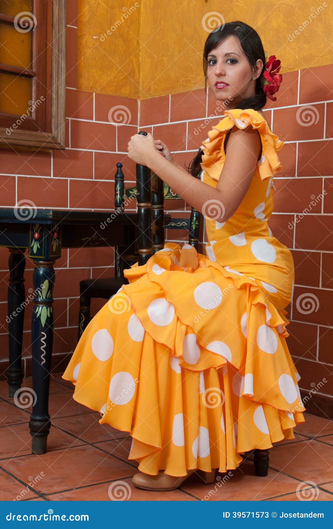 woman in traditional flamenco dresses dance during the feria de abril on april spain