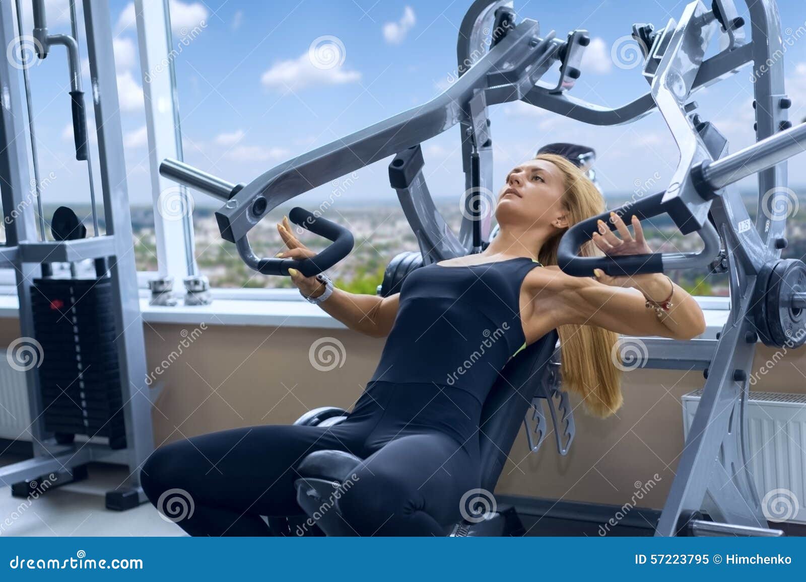 Woman trains pecs in gym stock image. Image of dumbbell - 57223795