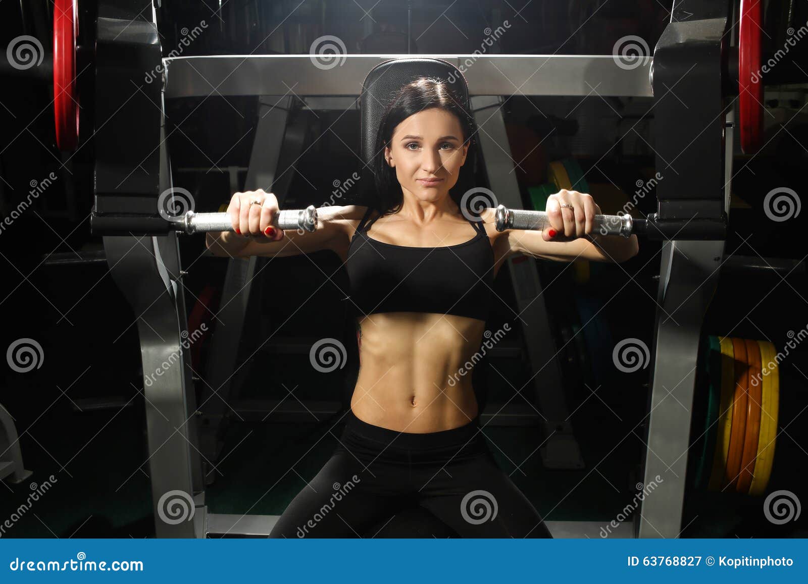 https://thumbs.dreamstime.com/z/woman-trains-pecs-gym-attractive-brunette-engaged-simulator-63768827.jpg