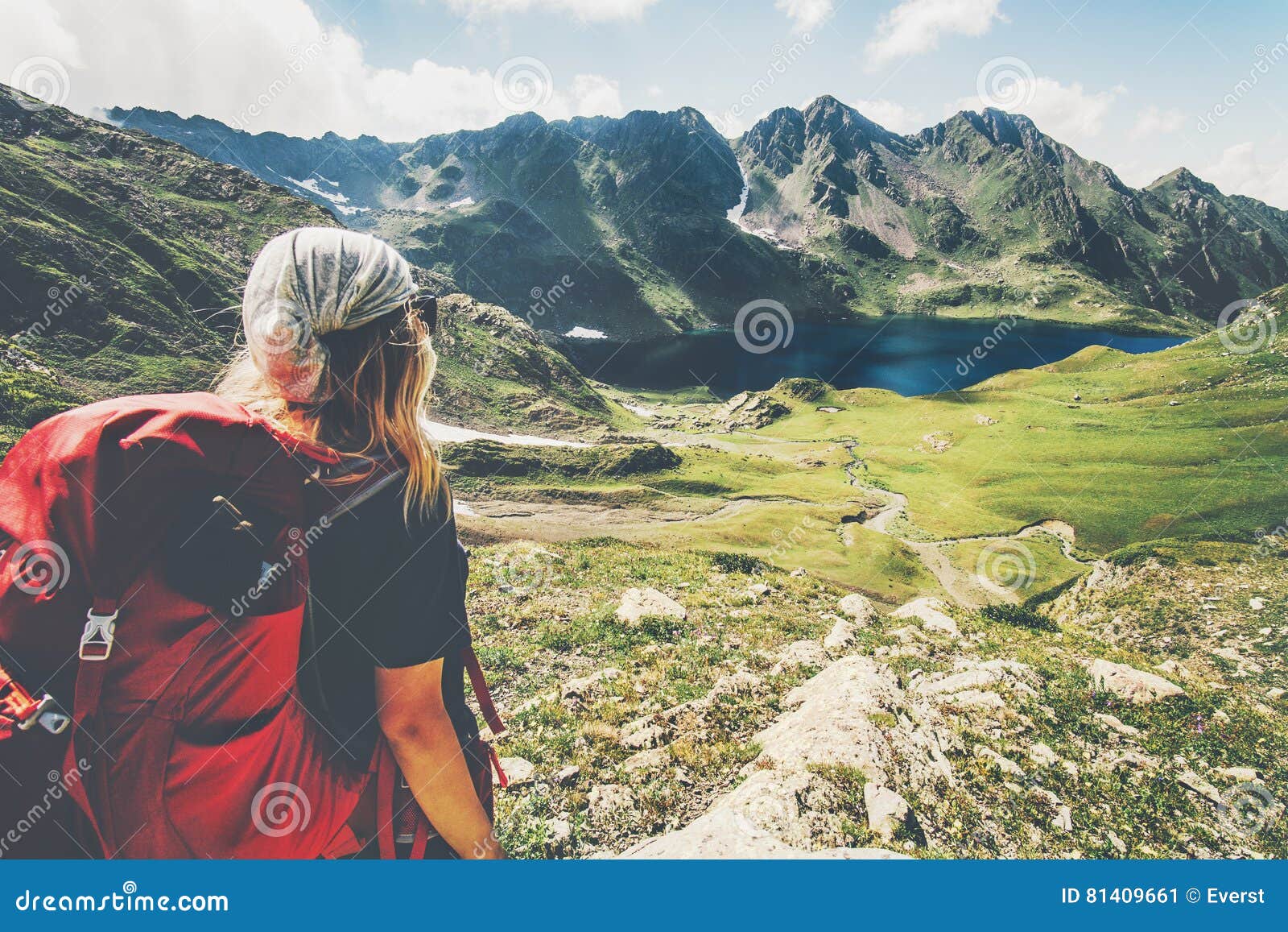 woman traveler with backpack hiking