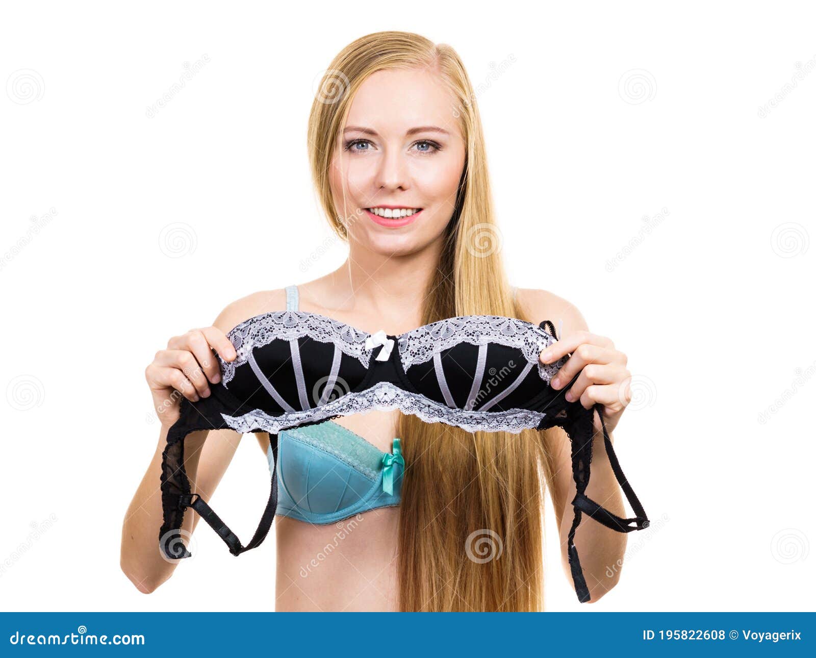 Woman trying on black bra - Stock Photo [66768745] - PIXTA