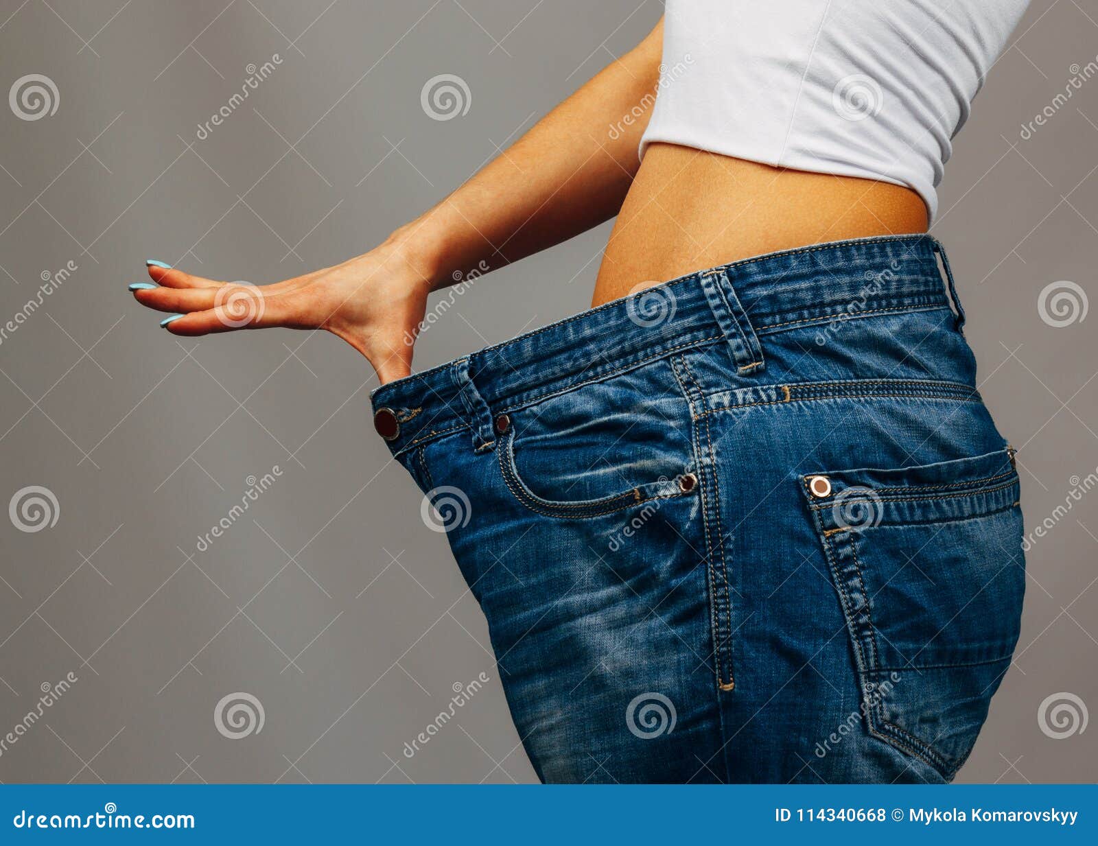 Woman trying jeans stock photo. Image of young, thin 114340668