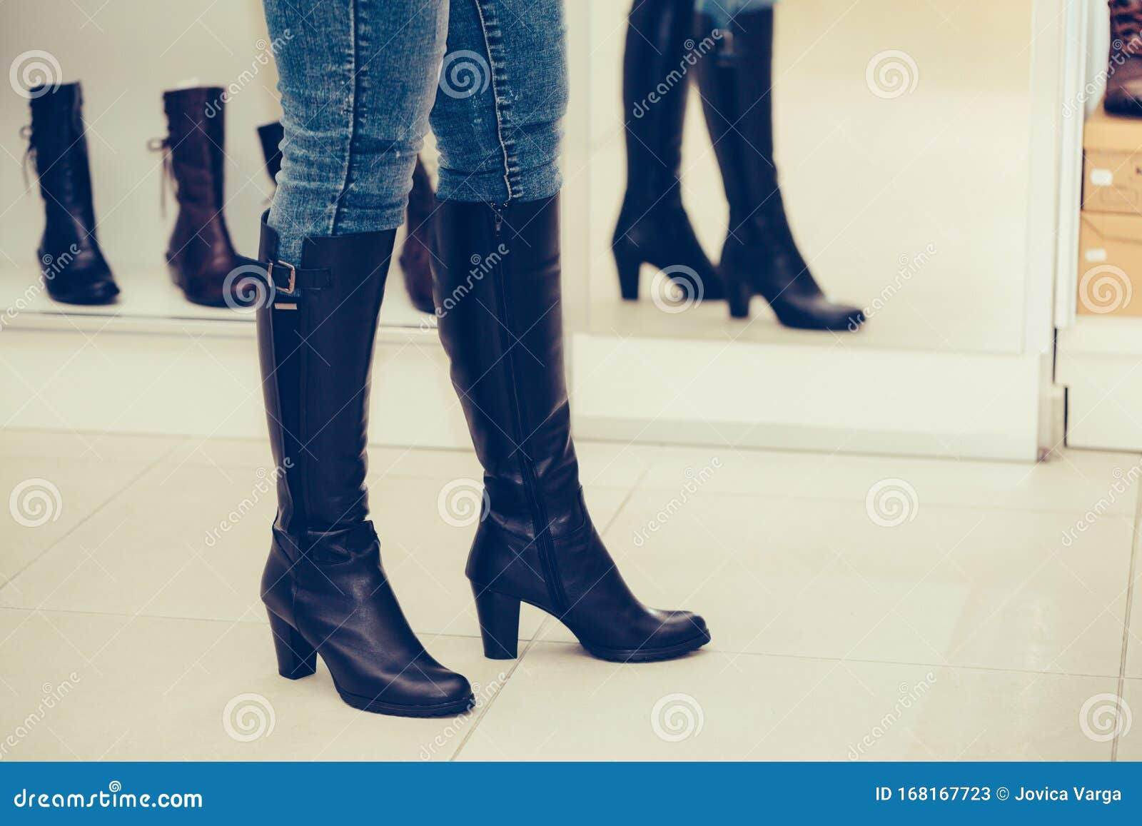 Woman Trying on a New Pair of Winter Boots with High Heels while ...