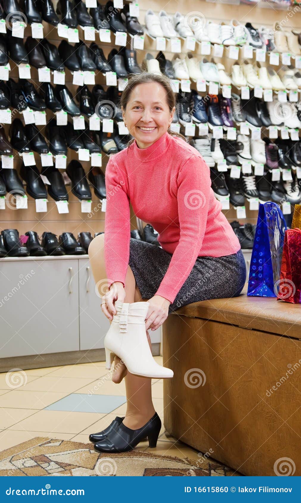 Woman Trying Shoes for Size Stock Photo - Image of pensioner, marketing ...