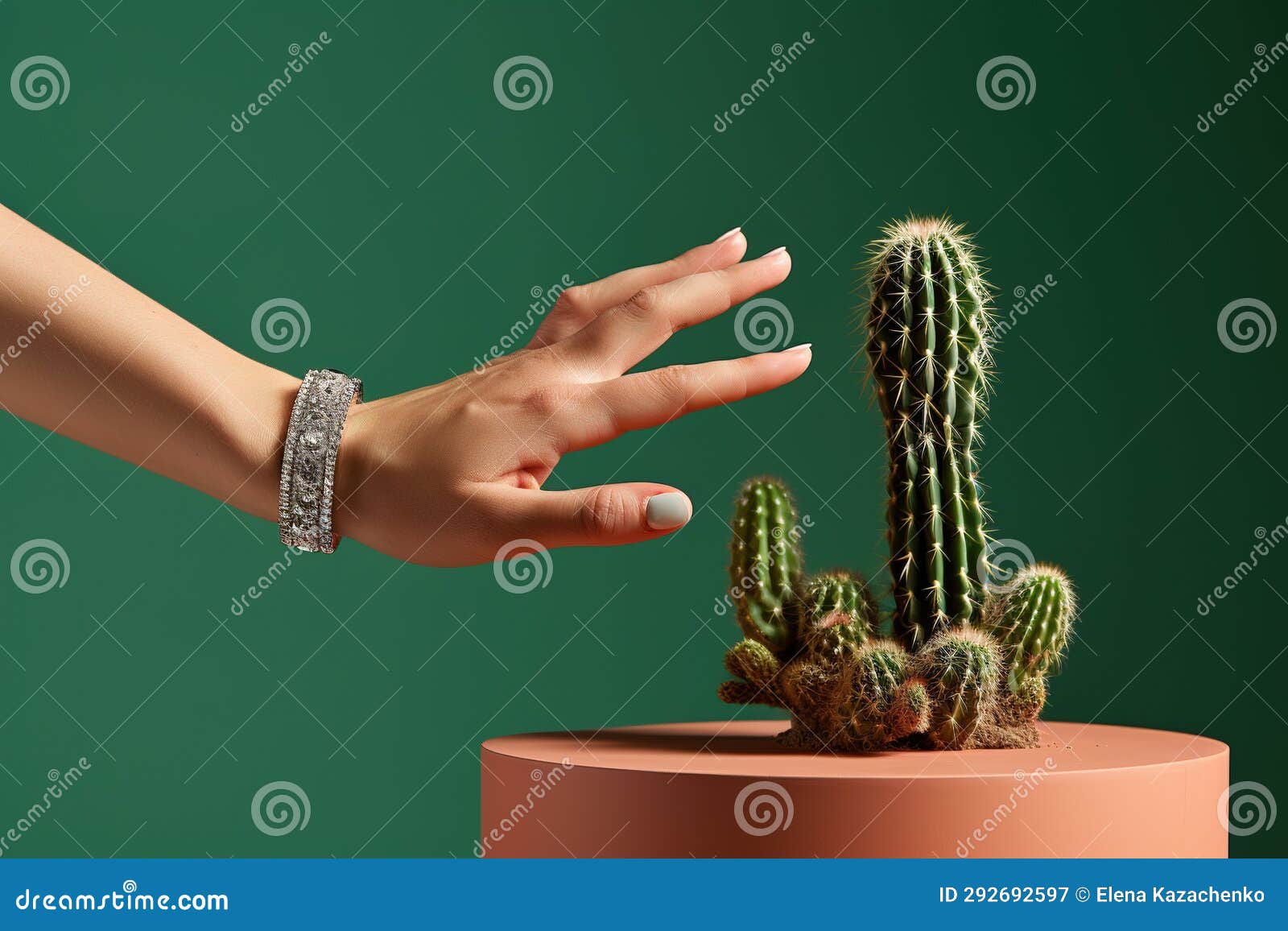 woman is trying to touch cactus, hand pointing at plant