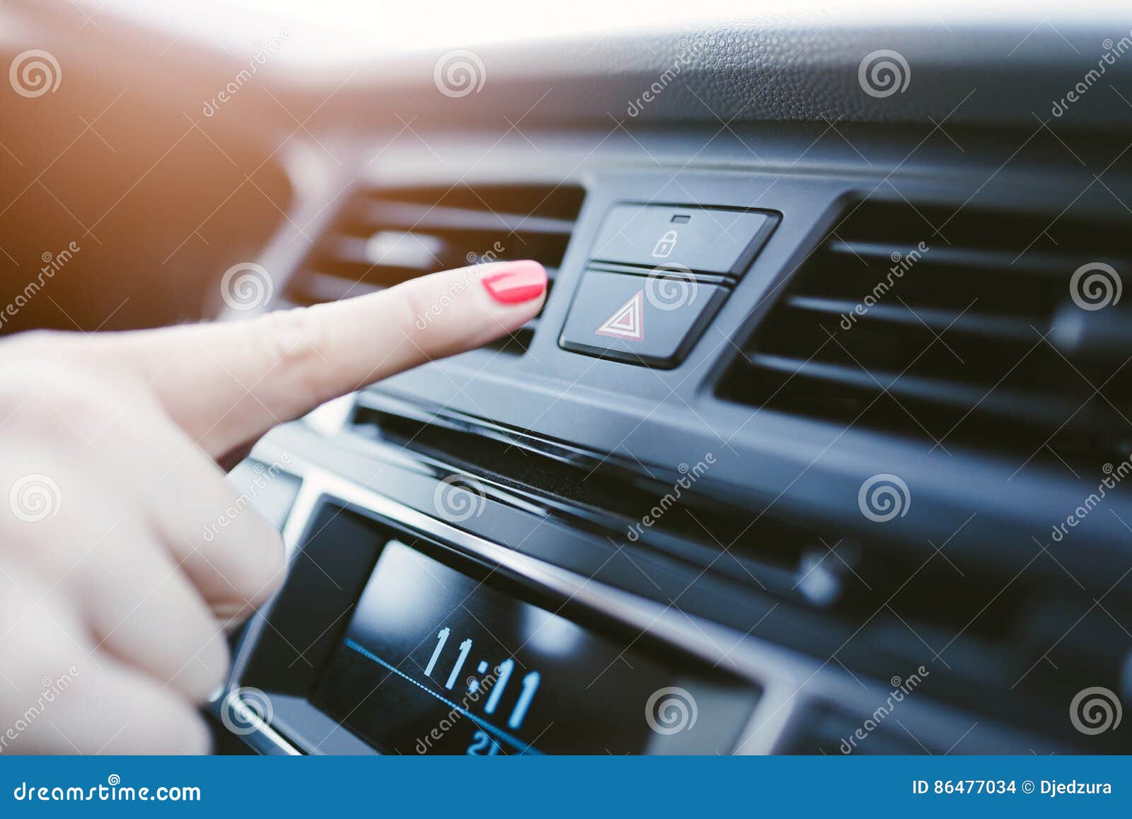 Woman Turns on the Emergency Lights in the Car. Stock Photo Image of