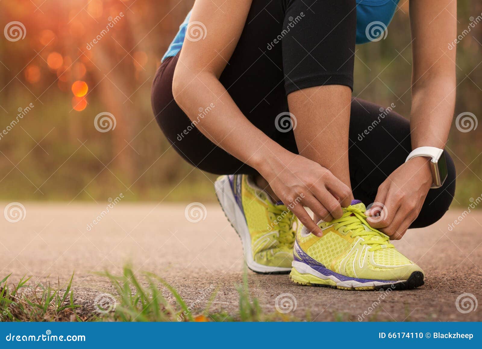 woman tying sport shoes