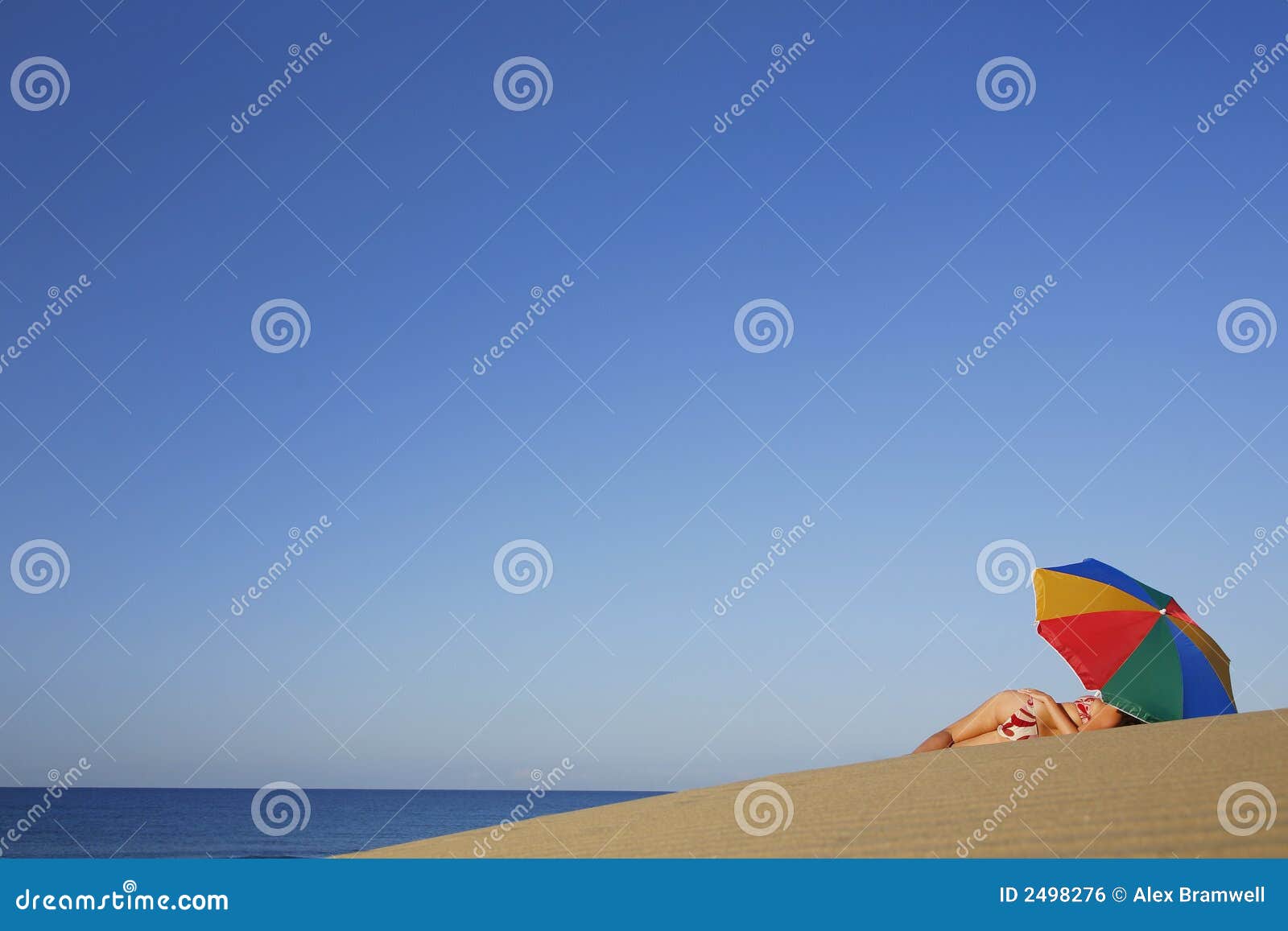 Woman under Parasol stock photo. Image of sand, colourful 2498276