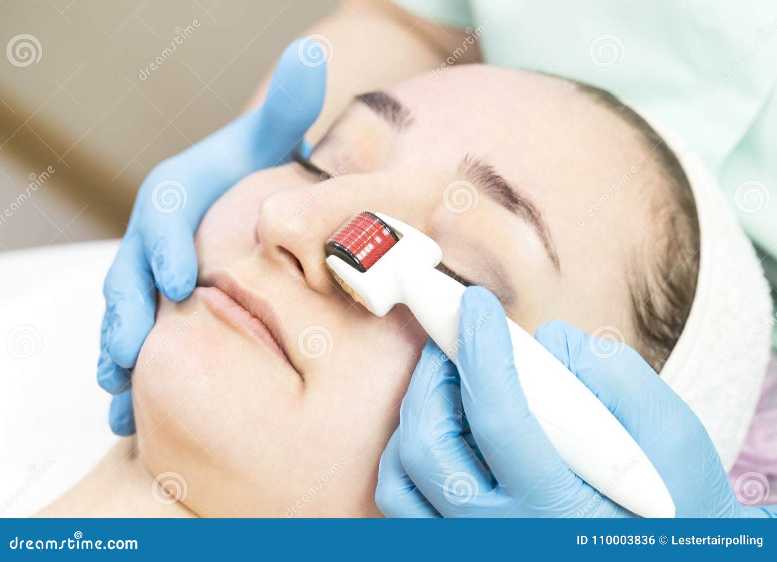 procedure of medical micro needle therapy with a modern medical instrument derma roller