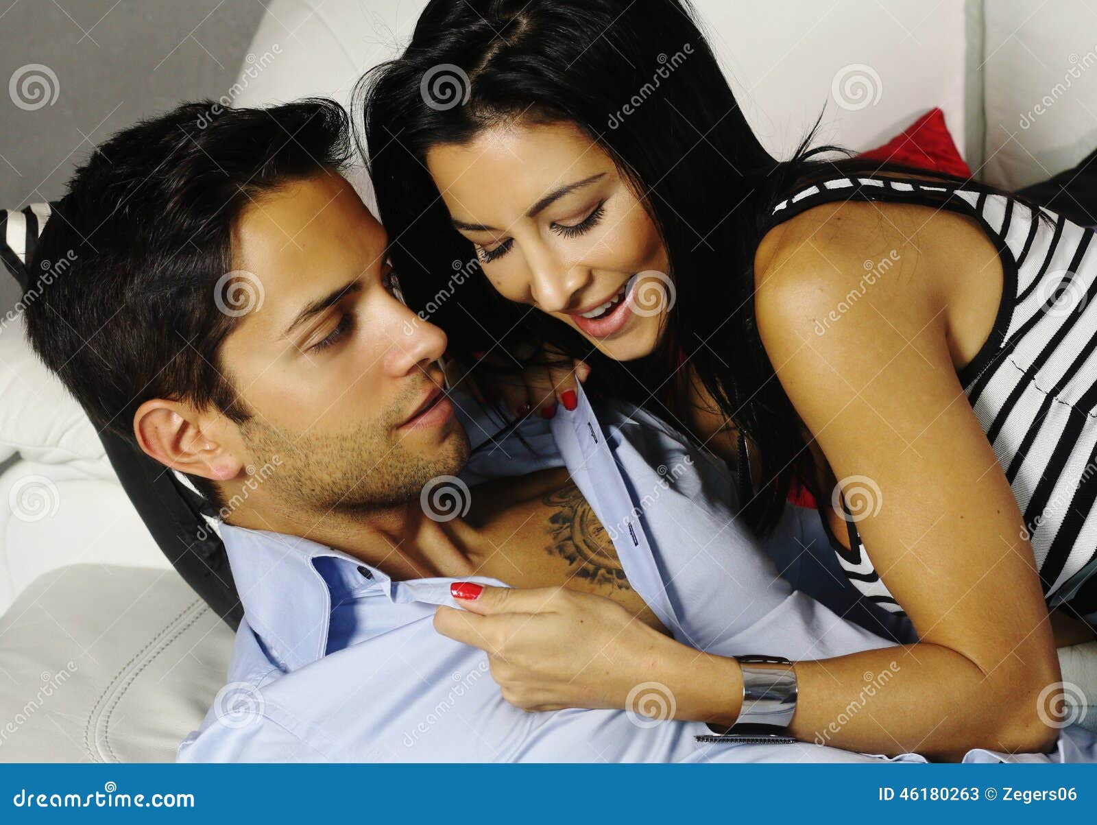 Woman Undressing a Brown Man Stock Image picture