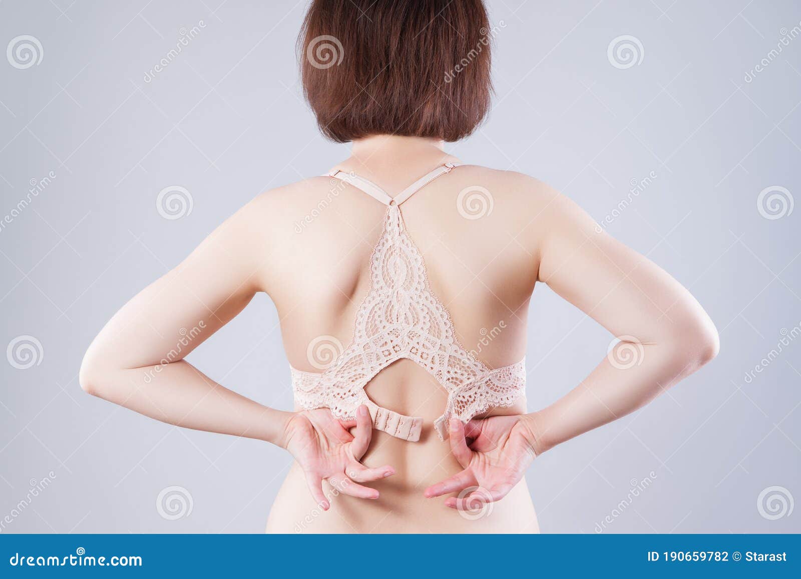 Woman Undressing and Unhooking Her Bra Stock Photo - Image of passion,  back: 190659782