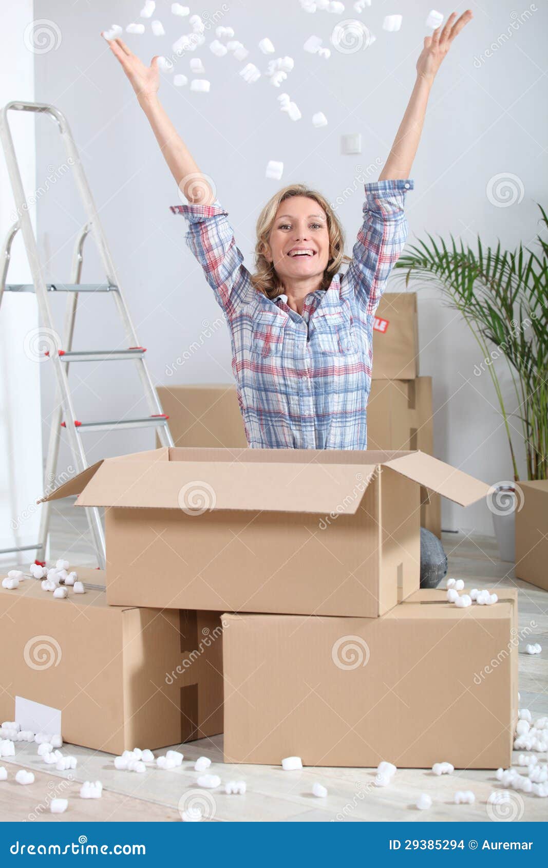 Woman unpacking boxes stock photo. Image of lifestyle 29385294