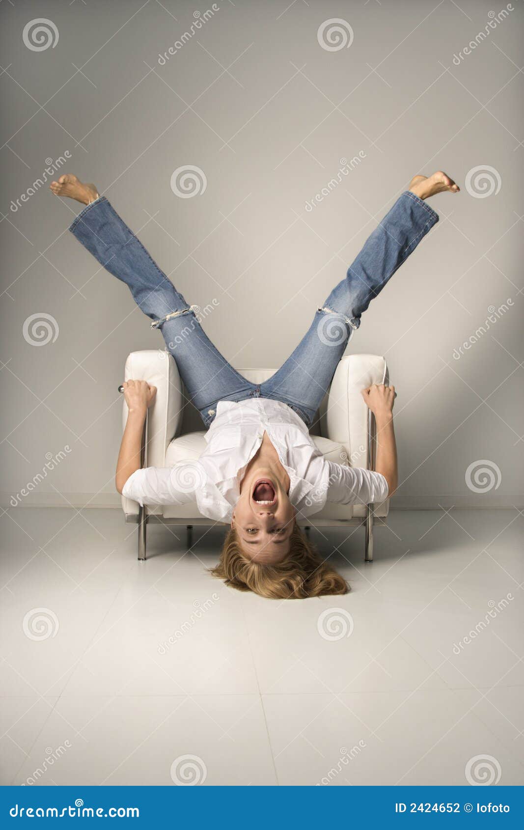 Woman Upside Down In Chair Stock Photo Image Of Vertical Blue