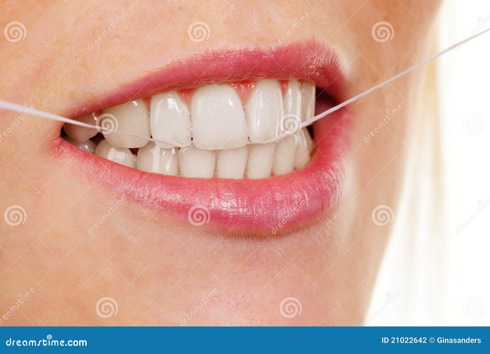 woman uses dental floss