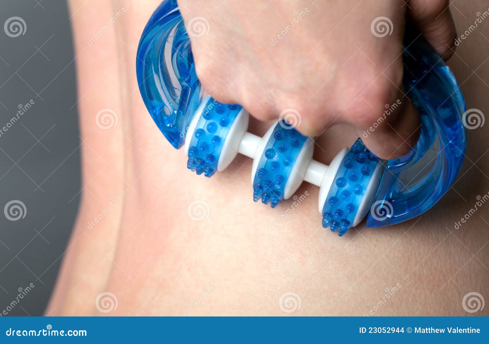 woman using back massager