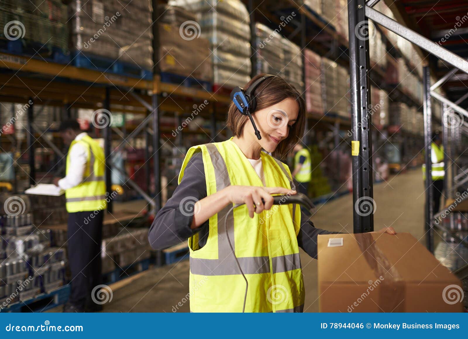 woman using a barcode reader in a distribution warehouse