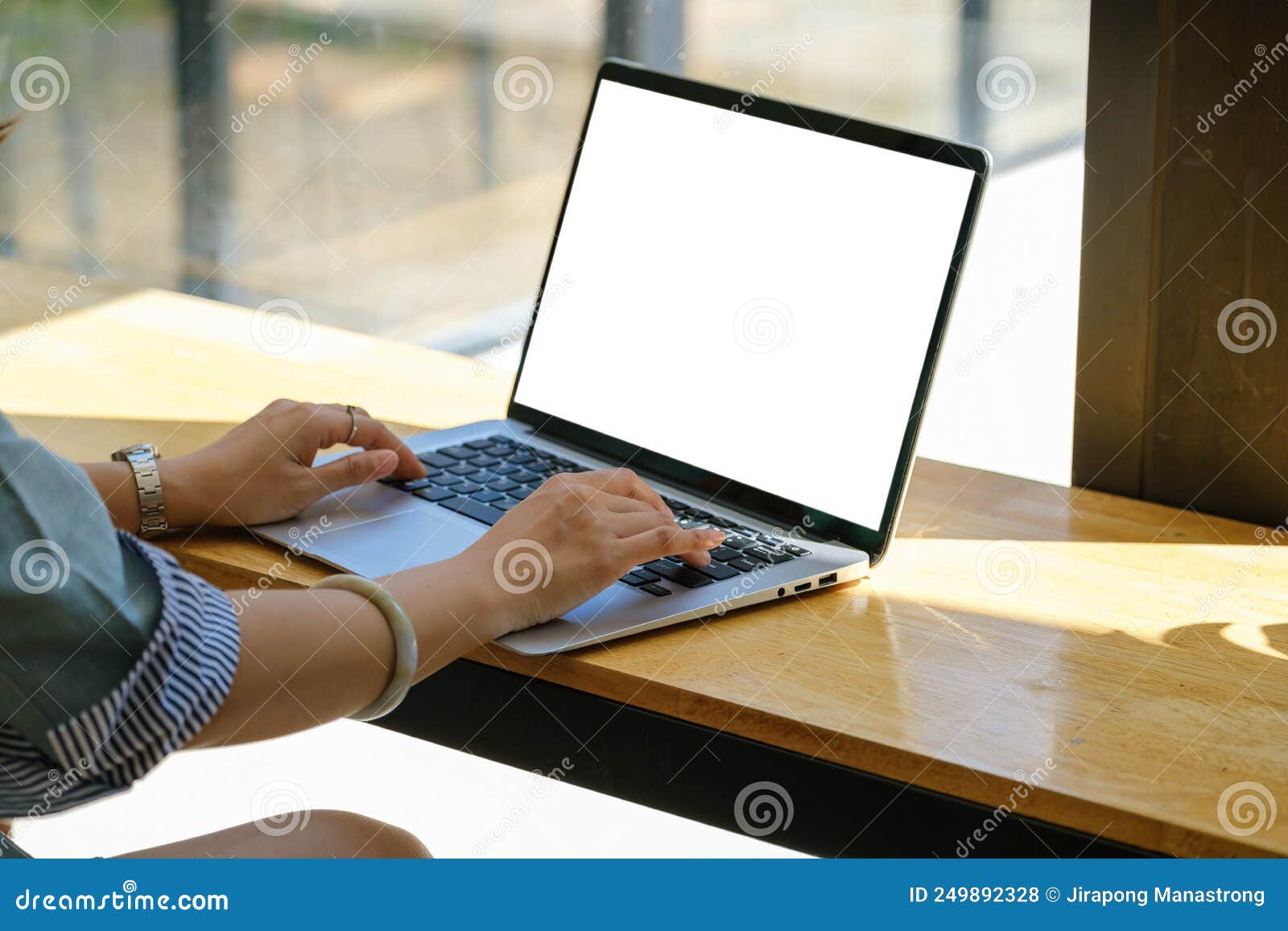 A Woman Using a Computer Laptop with a Blank White Screen. the Blank