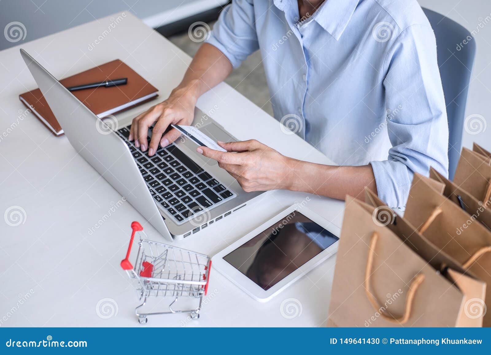 Woman Using Credit Card Register Security Code and Payments Online