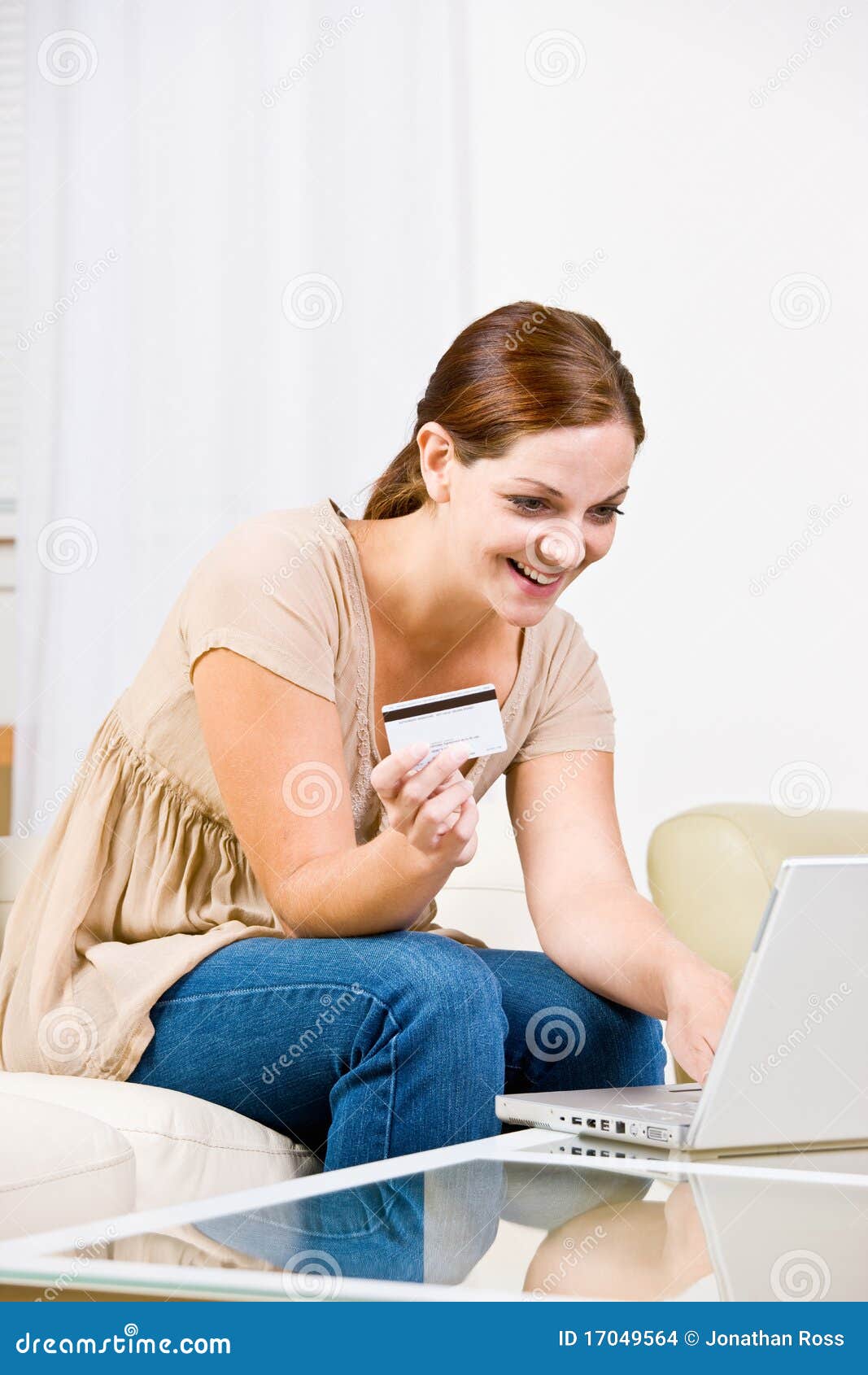 woman using creditcard to buy internet merchandise