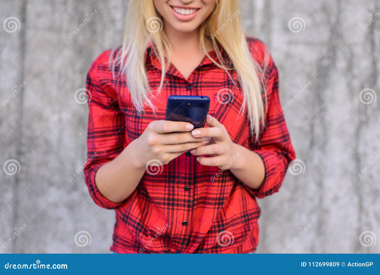 Woman Using Her Smartphone for Surfing the Internet, she is Watching Funny  Videos on the Internet. Young Girl with Beaming Smile Stock Image - Image  of casual, funny: 112699809