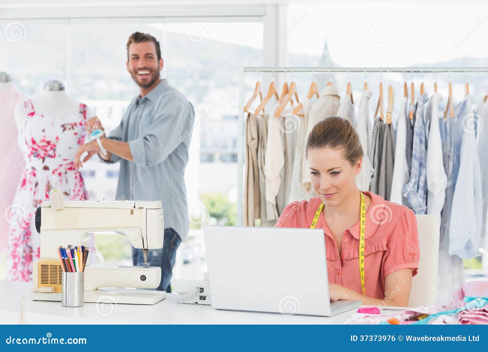 Woman Using Laptop with Fashion Designer Working at Studio Stock Photo ...