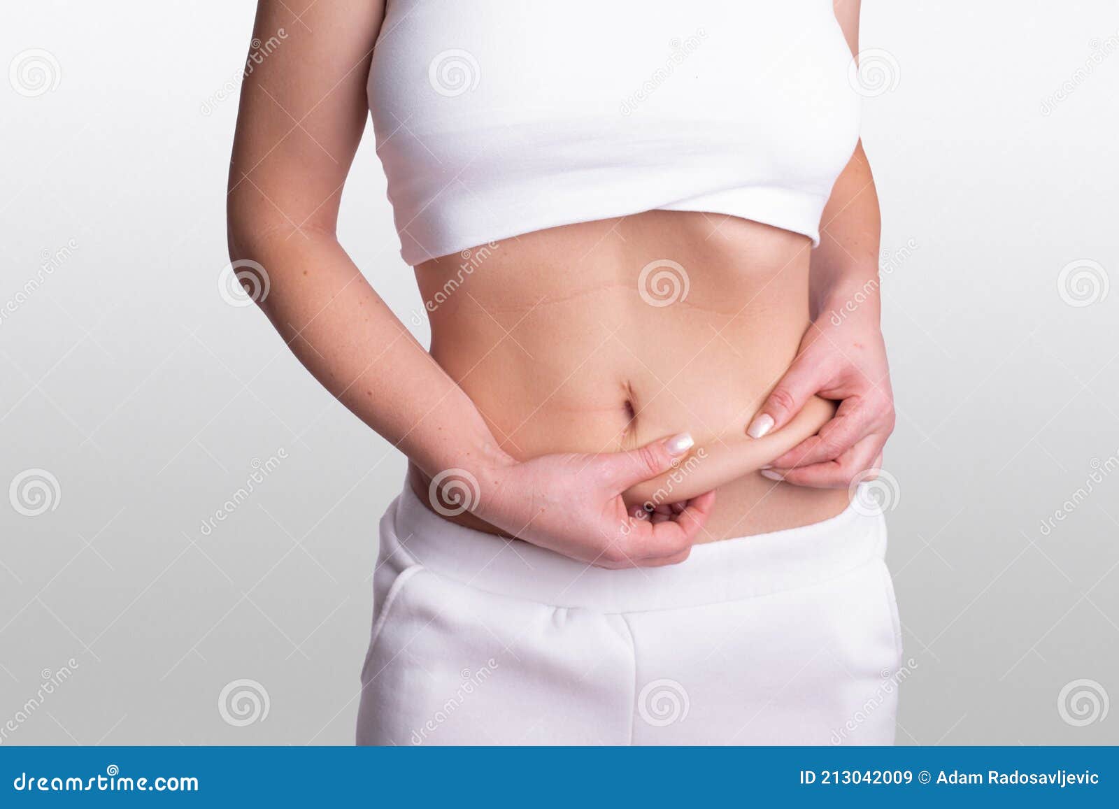 A Woman Using Pinch Test As One of the Methods for Measuring Body Fat