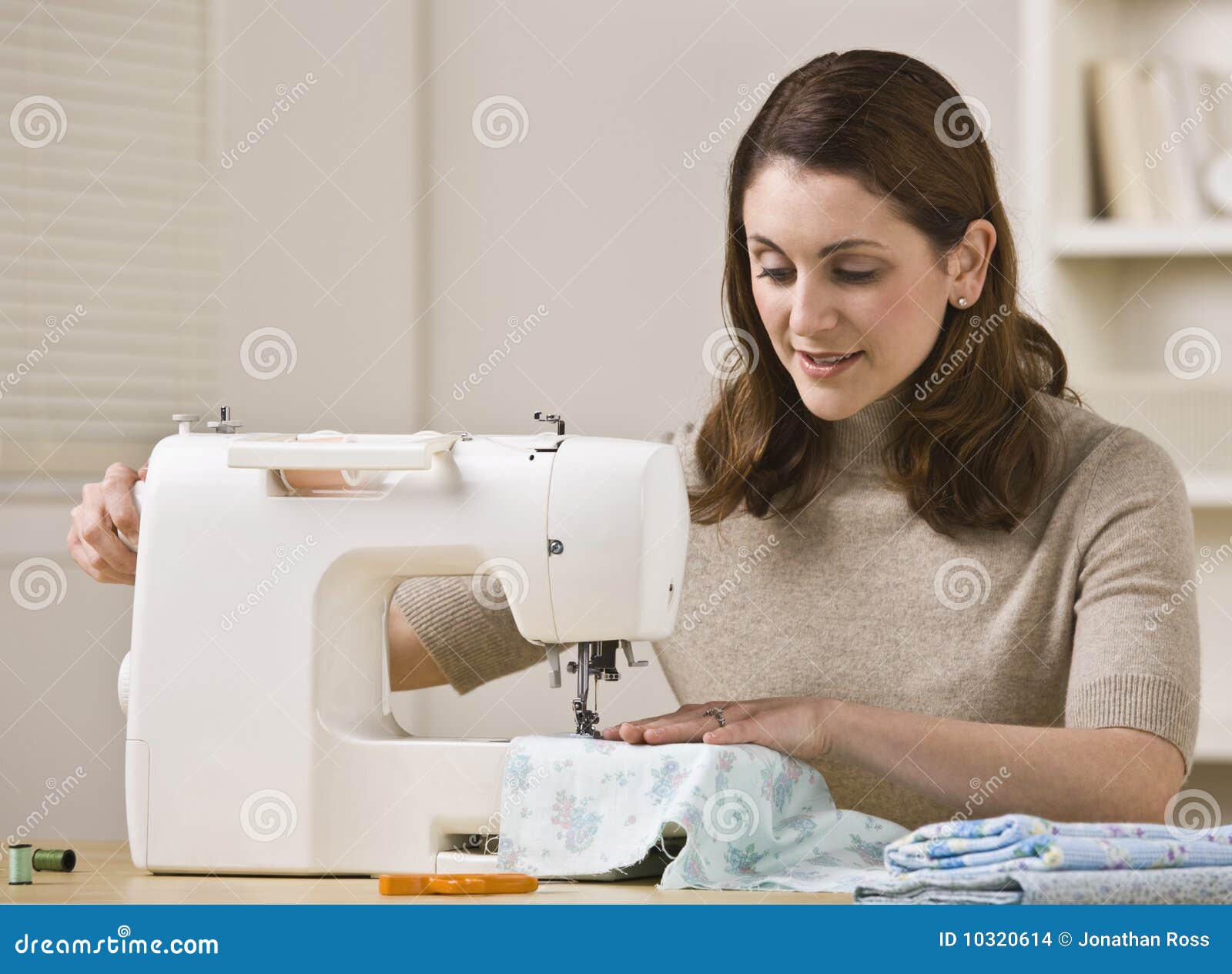 Woman Using Sewing Machine stock photo. Image of hair 10320614