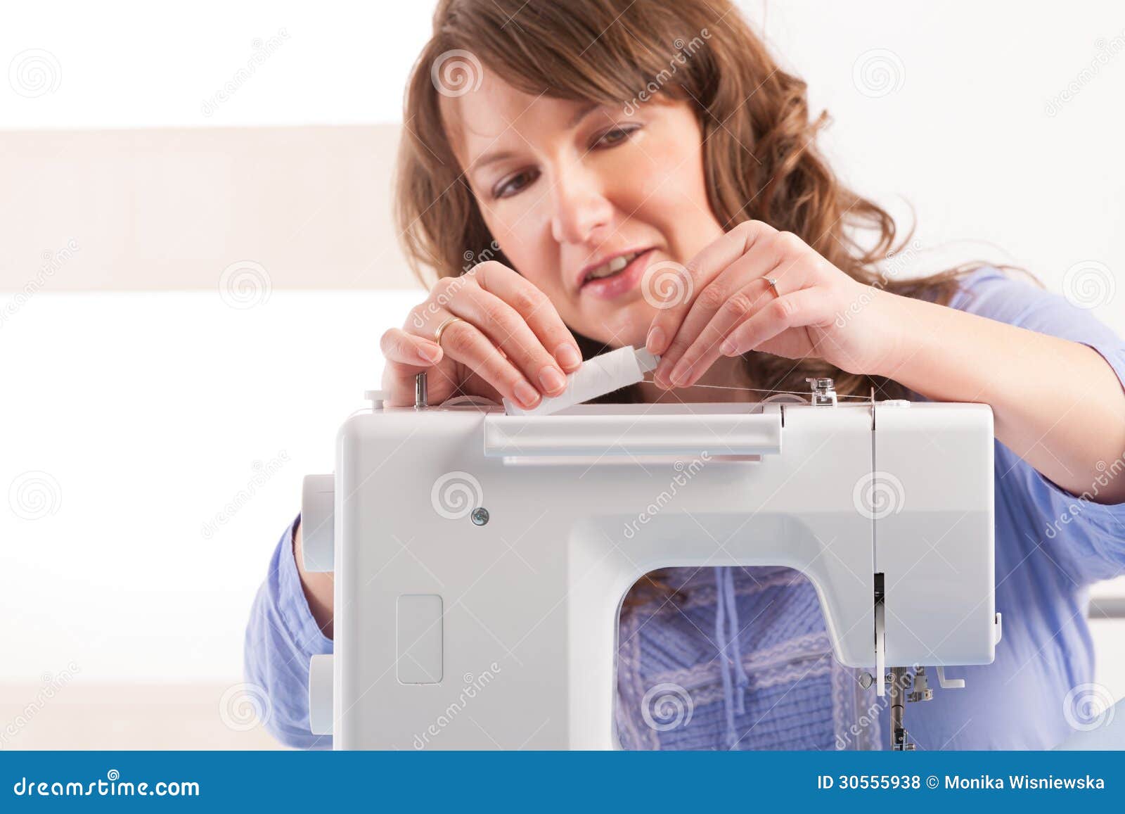 Woman using sewing machine stock photo. Image of people 30555938