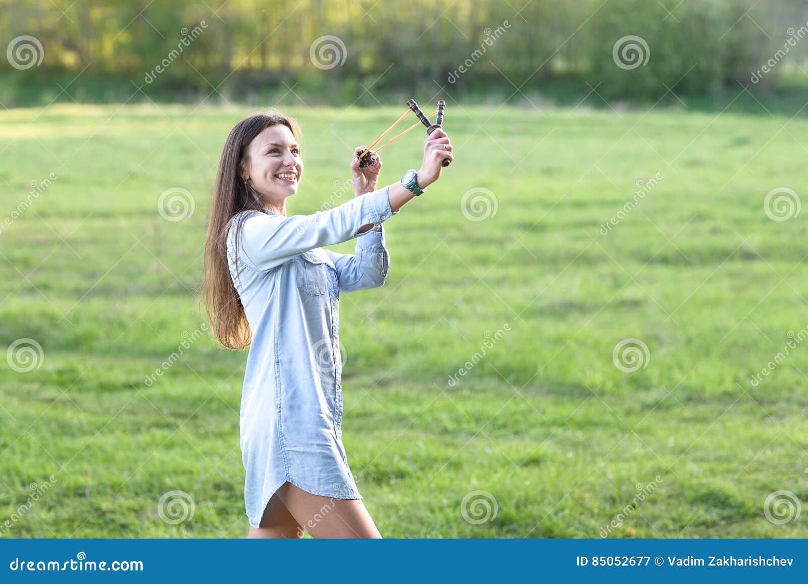 Woman using a slingshot. stock image. Image of beautiful 85052677