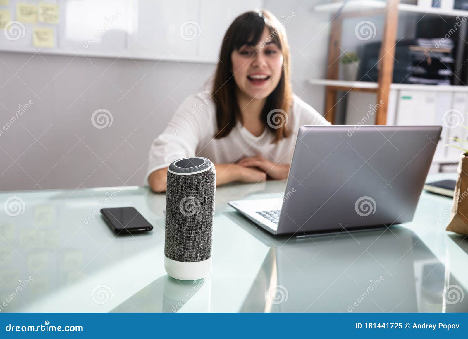 woman using voice assistant in office