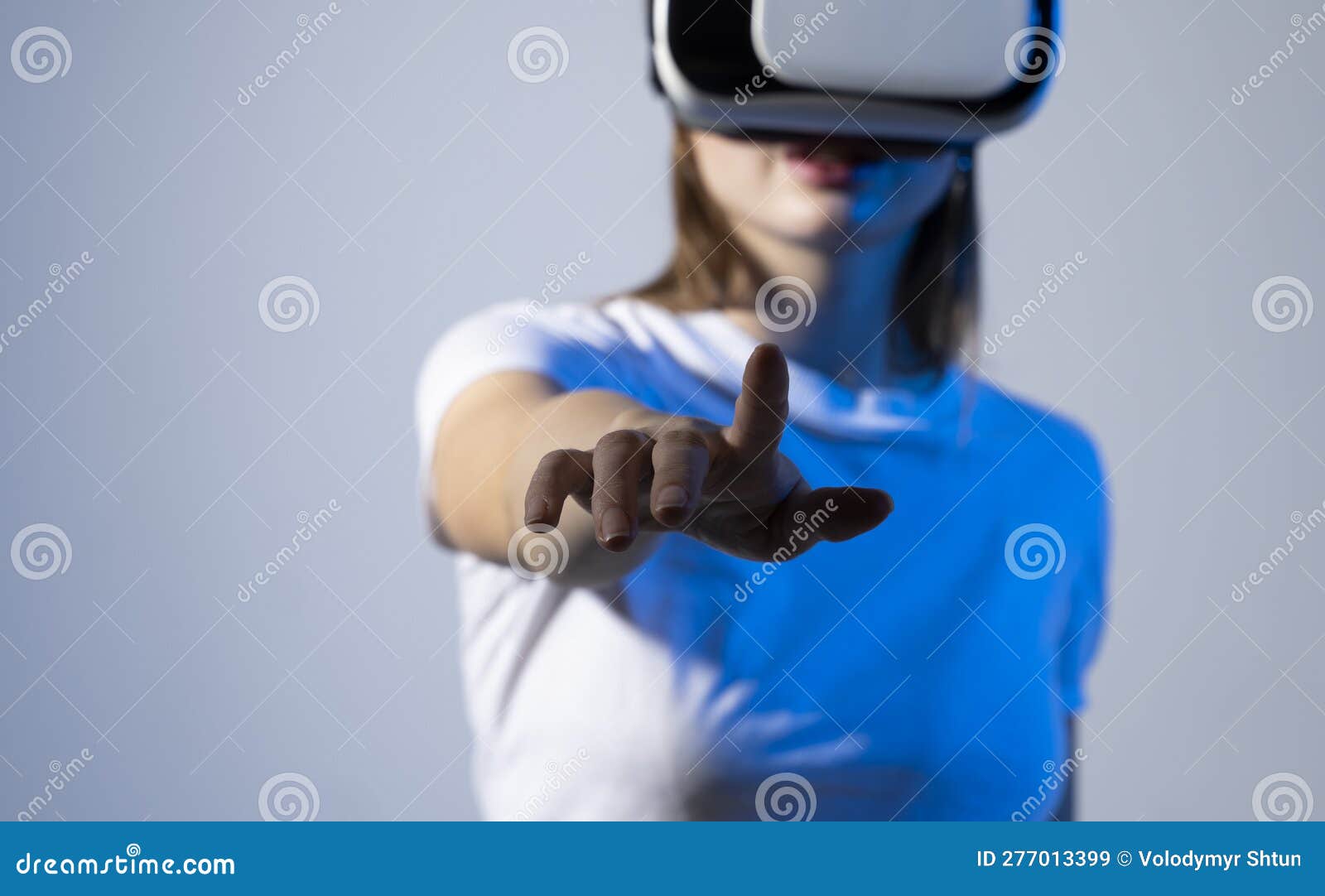 Woman Using VR Virtual Reality Glasses Headset Pointing at Objects in