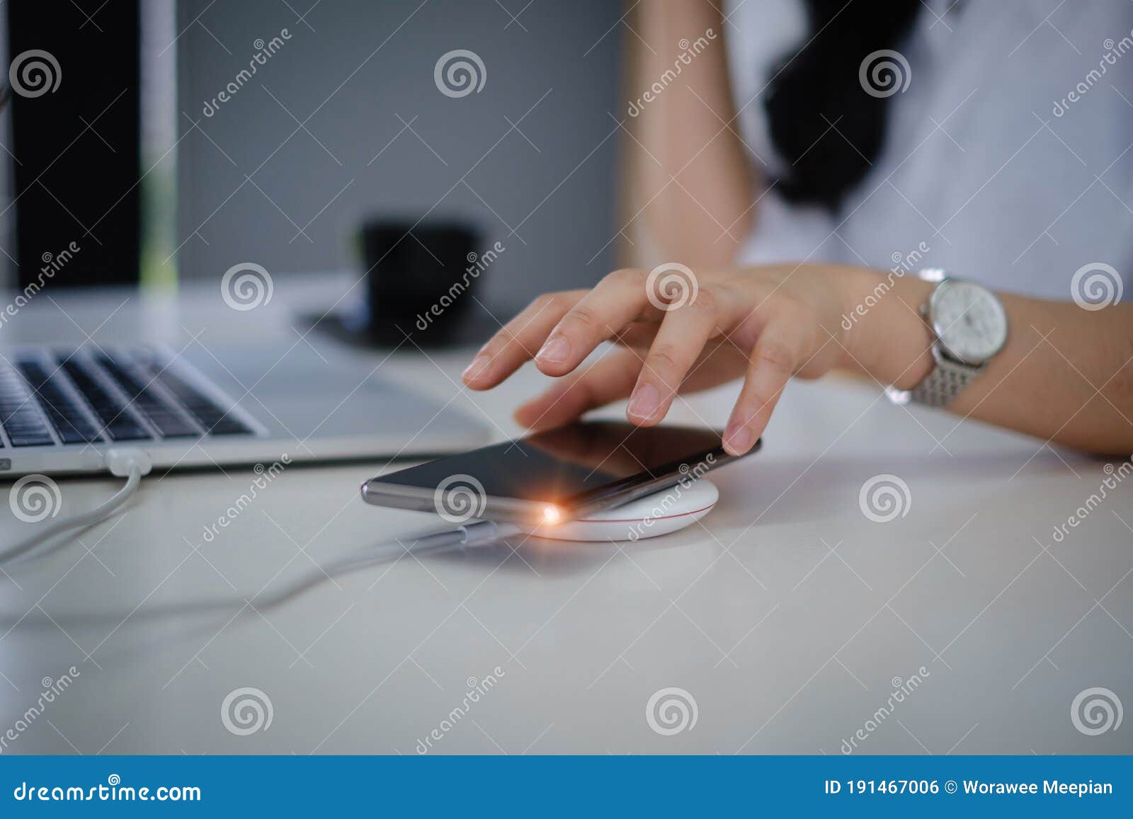 woman using wireless charging . technology concept