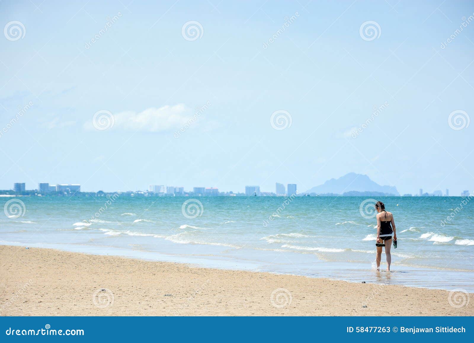 Woman walk on the beach editorial stock photo. Image of blue - 58477263