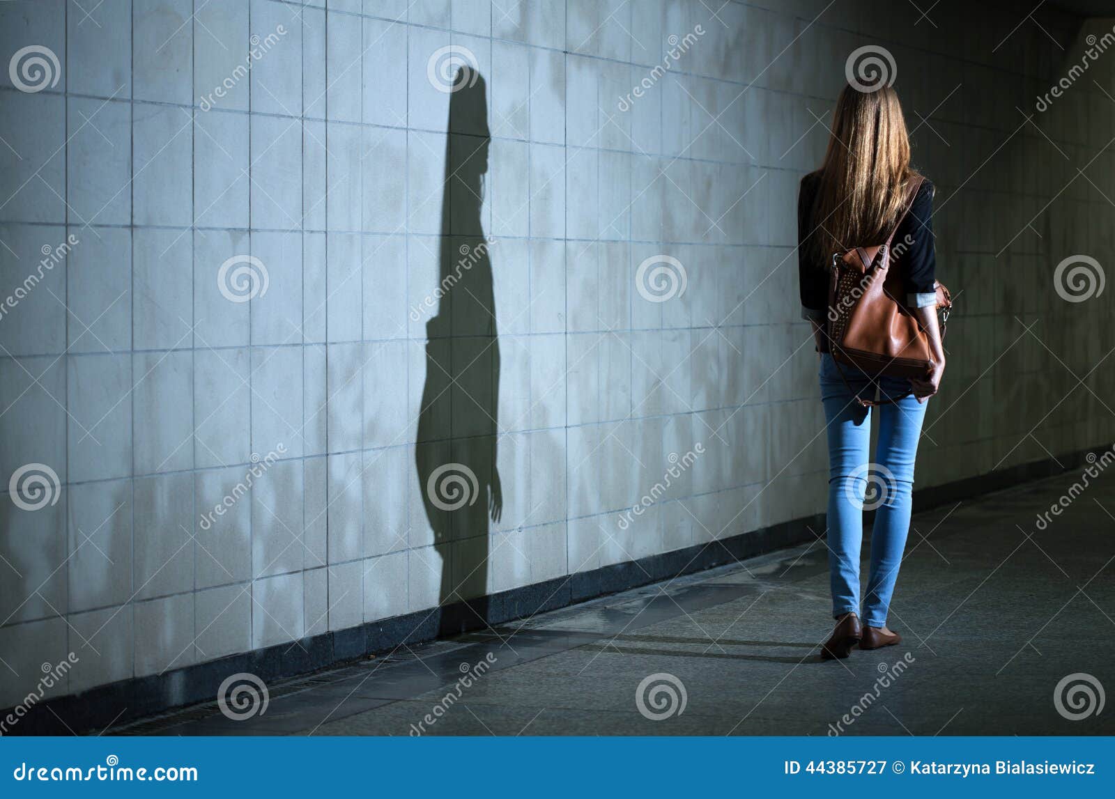 woman walking alone at night