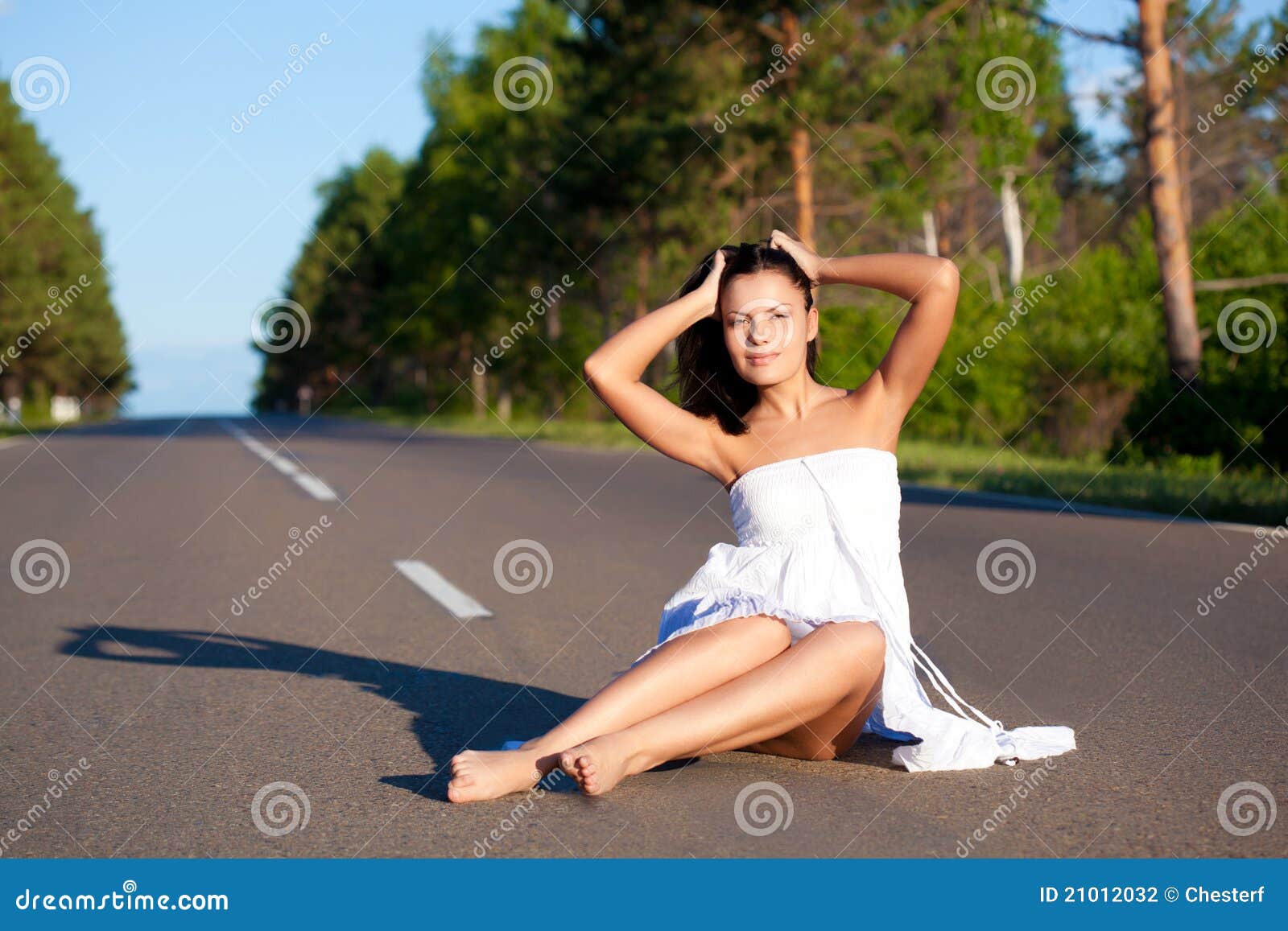 https://thumbs.dreamstime.com/z/woman-walking-along-road-21012032.jpg?ct=jpeg