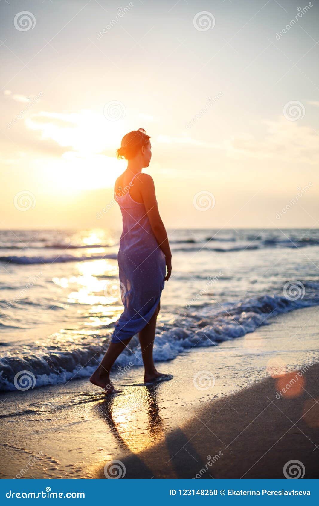 Woman Walking on the Beach in the Surf at Sunset Stock Photo - Image of ...