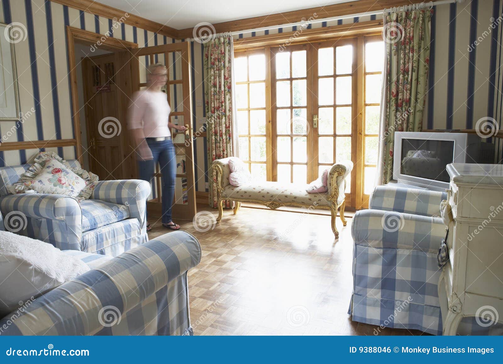 Woman Walking through Lounge Stock Photo Image of home, modern 9388046